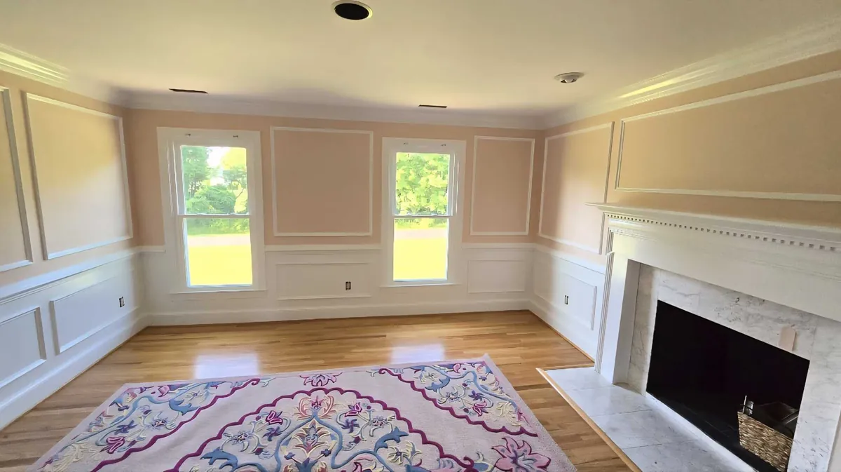 Formal dining room with fresh interior paint, picture-frame wainscoting and crown moulding